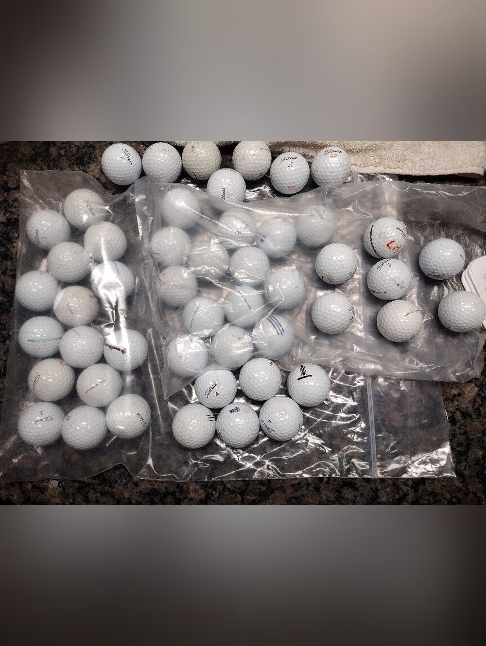 Lot of 50 Titleist golf balls gently used white